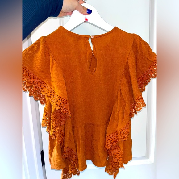 Orange blouse with ruffles on the sides. Super cute for the office or a date! - Picture 2 of 3